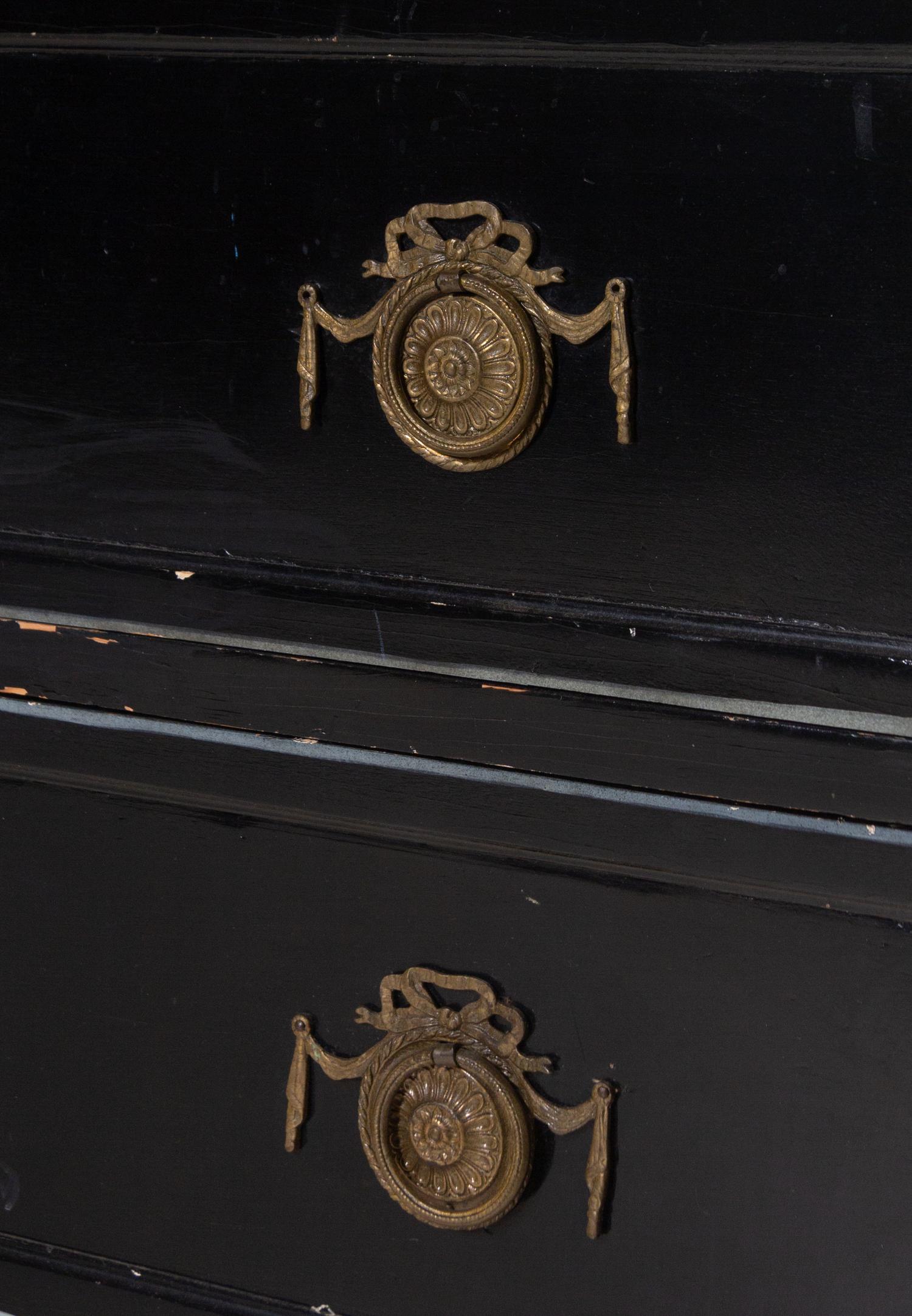 An Italian Gilt Metal Mounted Ebonized Chest of Drawers