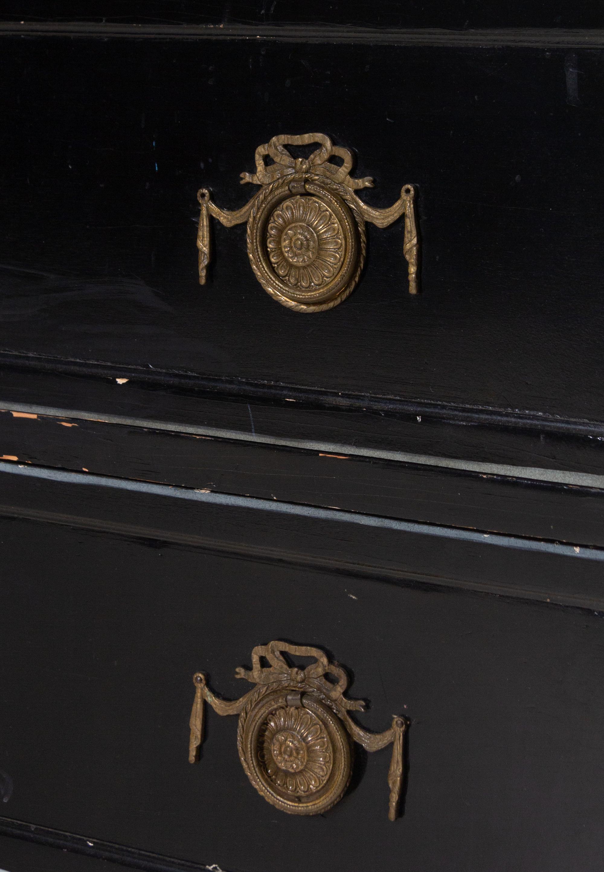 An Italian Gilt Metal Mounted Ebonized Chest of Drawers