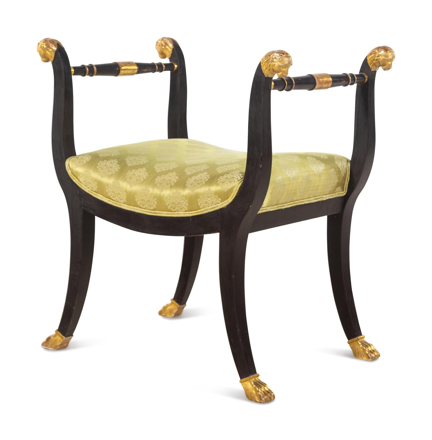 An Italian Parcel Gilt and Ebonized Curule Bench