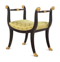 An Italian Parcel Gilt and Ebonized Curule Bench