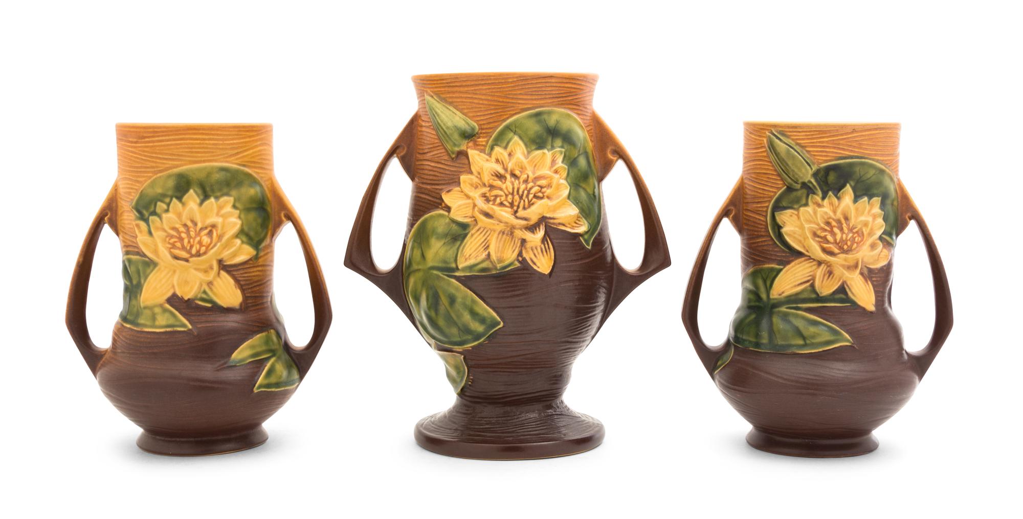 Three Roseville Waterlilly Pottery Vases Height of first 9 1/4 inches, pair 8 inches.