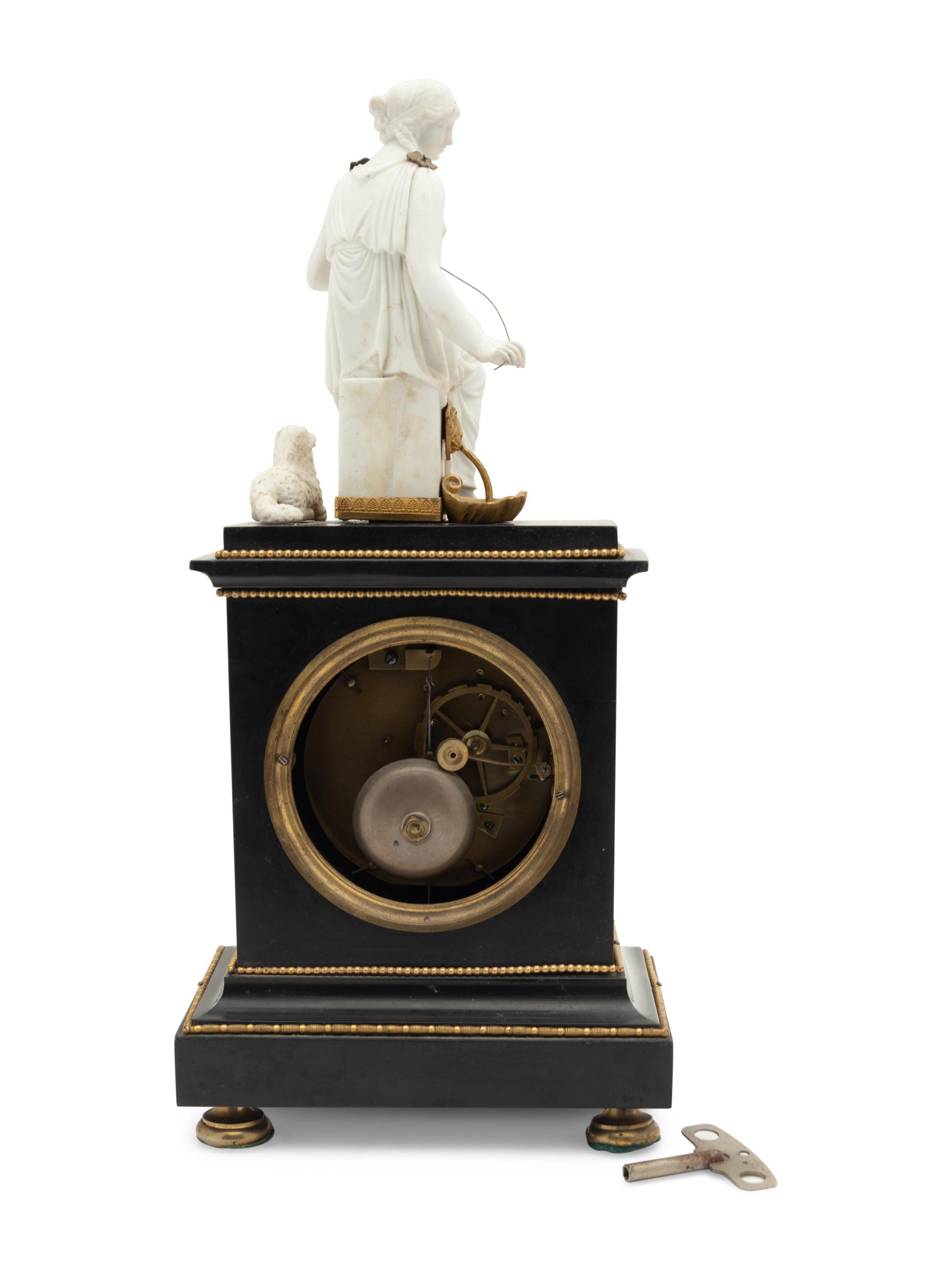 An Empire Gilt Metal Mounted Figural Mantel Clock