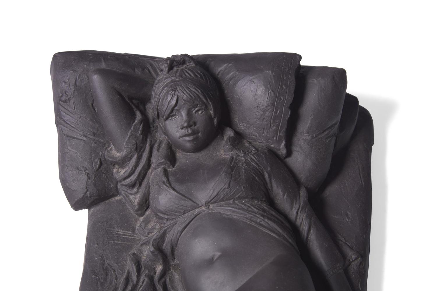 A Wedgwood Black Basalt "Girl on Bed" Figure
