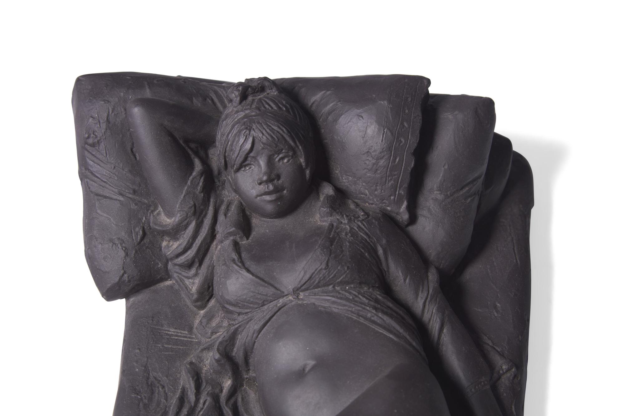 A Wedgwood Black Basalt "Girl on Bed" Figure
