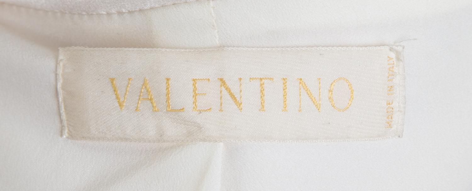 A Valentino Cream Wool Tuxedo Peplum Jacket, Size 10.
