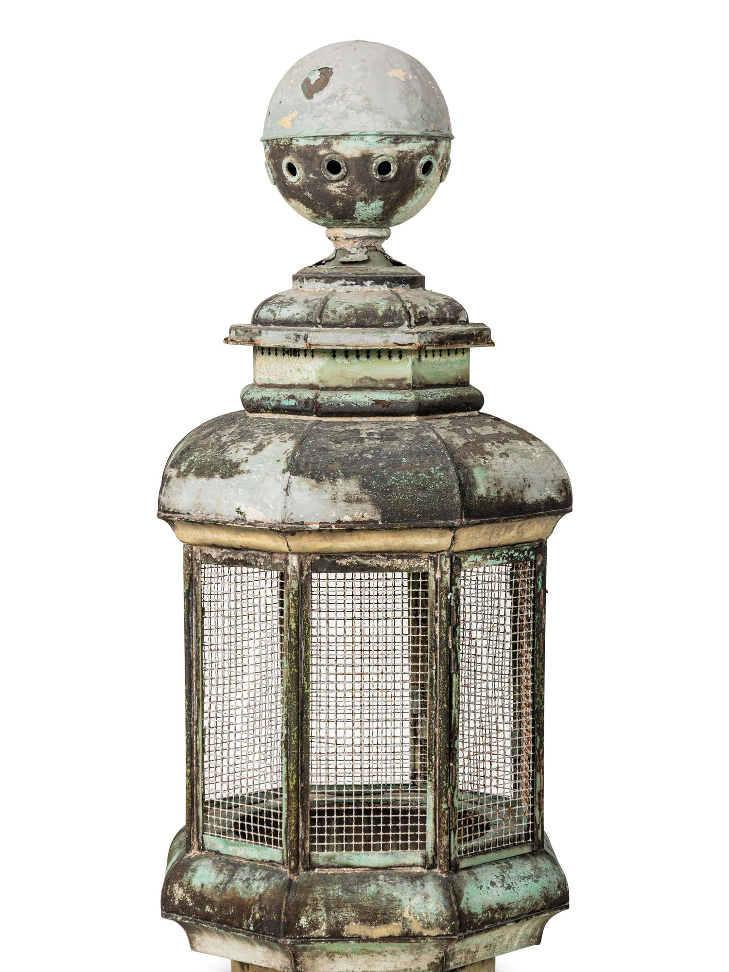 A Pair of Weathered Painted Sheet Metal Lanterns Converted to Bird Cages