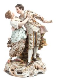 A Volkstedt Porcelain Figural Group Height 10 x width 6 1/2 inches.