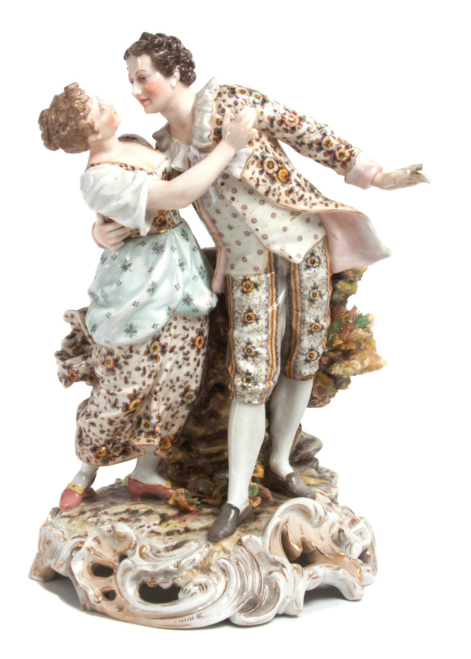 A Volkstedt Porcelain Figural Group Height 10 x width 6 1/2 inches.