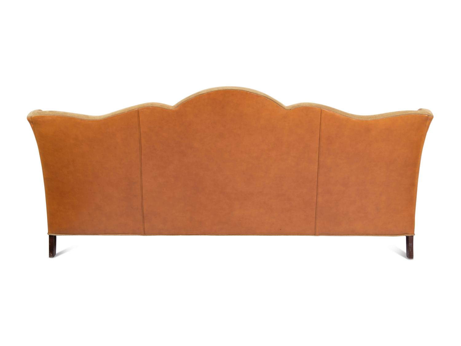 A Custom Leather Upholstered Camelback Sofa