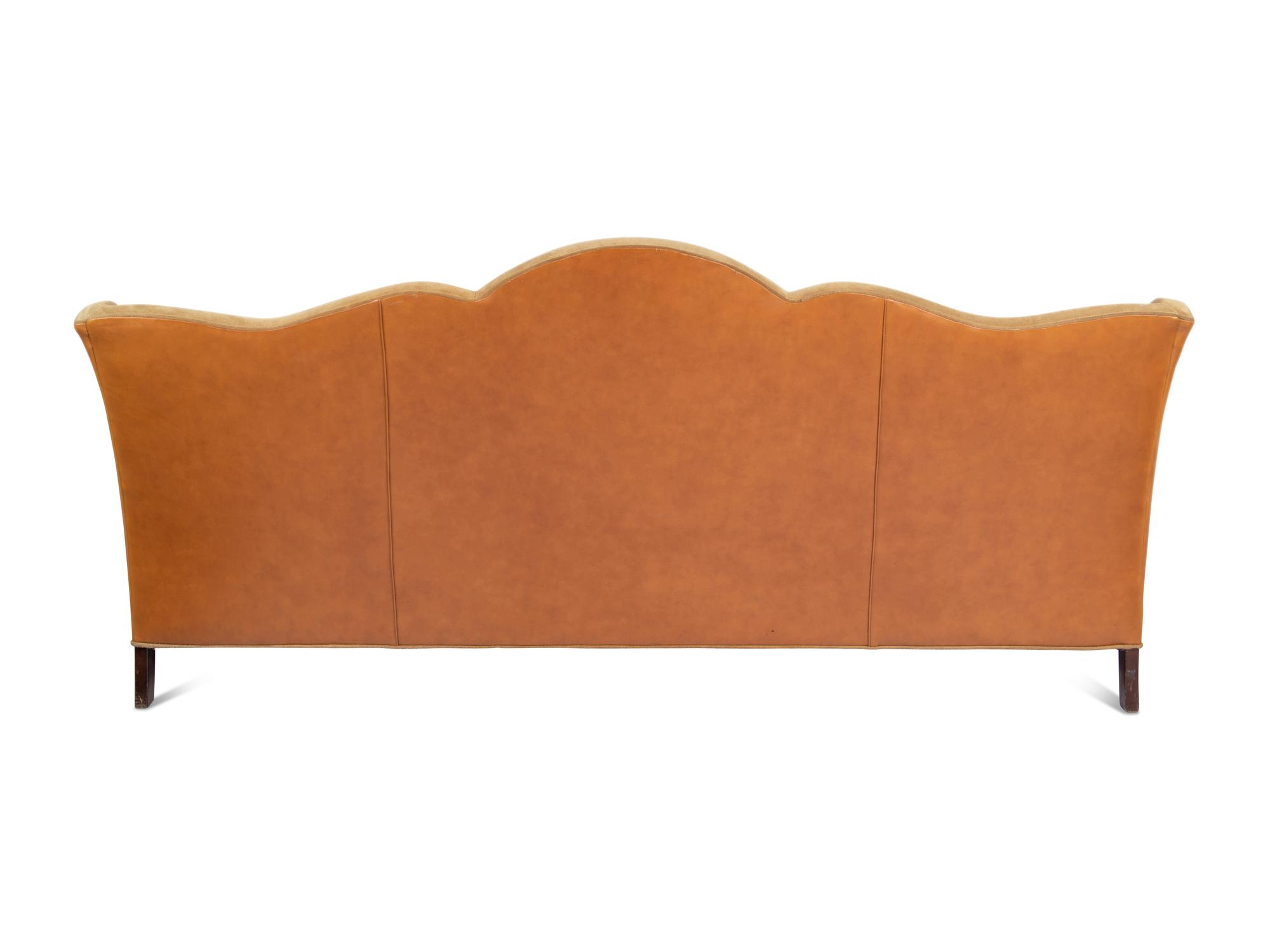 A Custom Leather Upholstered Camelback Sofa