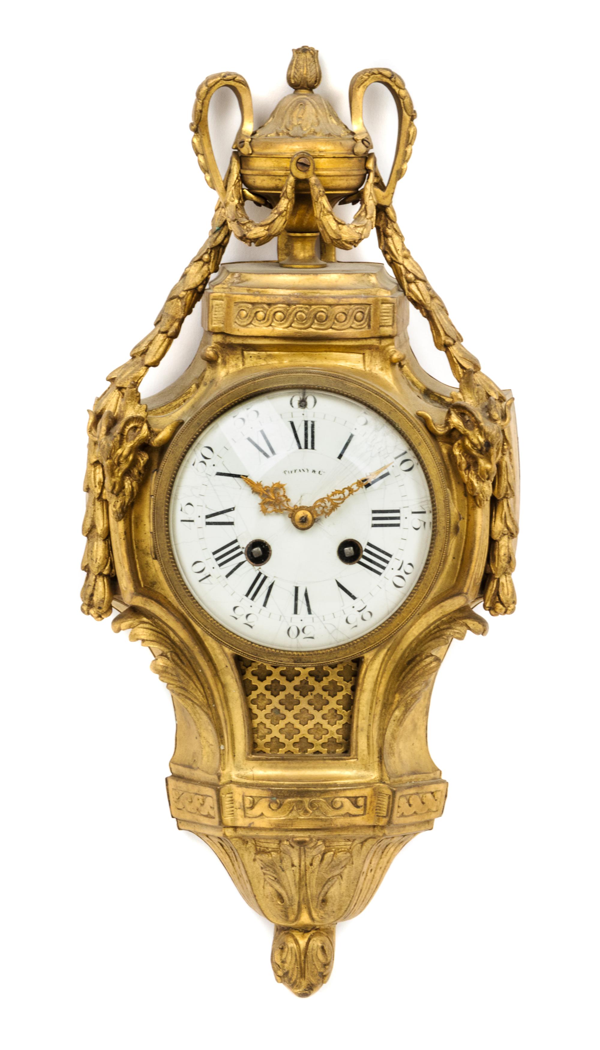 A Louis XVI Style Gilt Bronze Cartel Clock Height 16 1/2 inches. — RETAILED BY TIFFANY & CO.