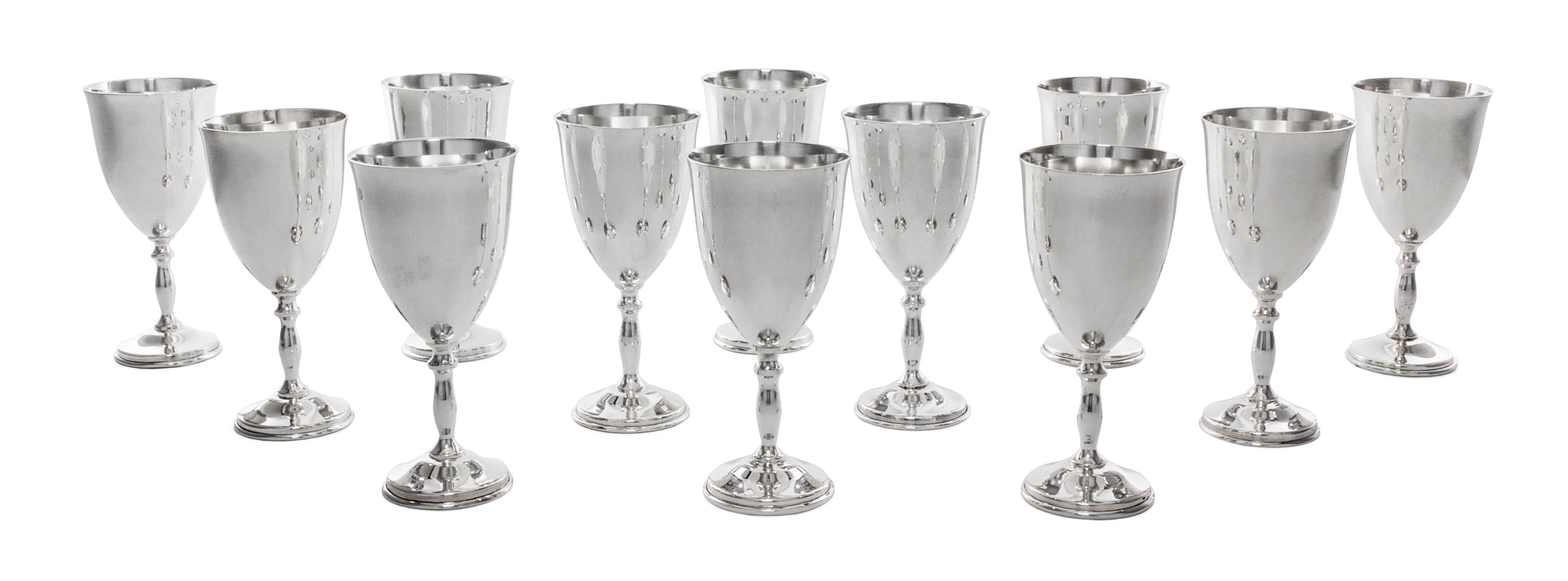 A Set of Twelve Mexican Silver Cordials, Maker's Mark MMR, with baluster form stems ending in circular feet.