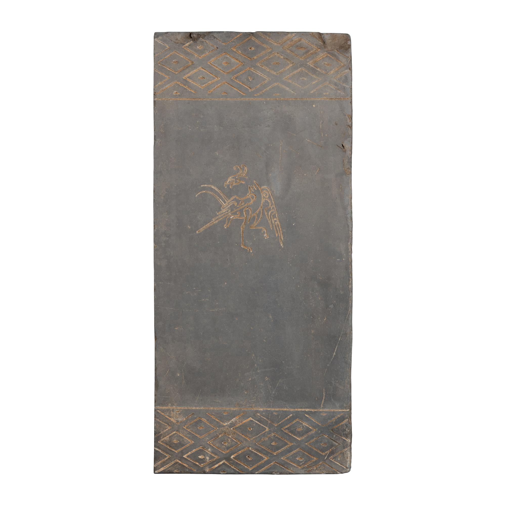 A Chinese Grey Pottery 'Vermilion Bird' Tomb Brick Fragment, Han Dynasty — 漢 模印朱雀紋陶磚