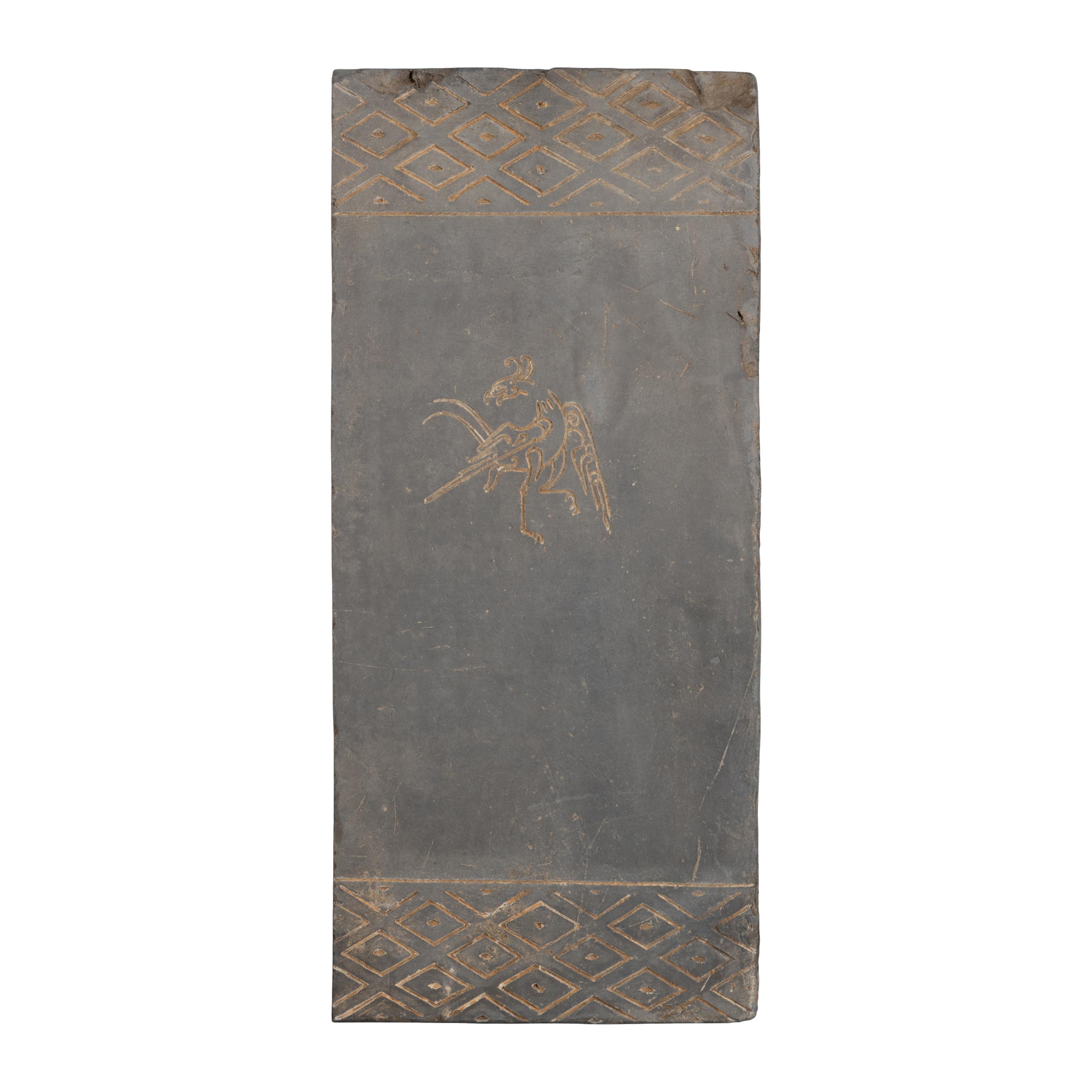 A Chinese Grey Pottery 'Vermilion Bird' Tomb Brick Fragment, Han Dynasty — 漢 模印朱雀紋陶磚