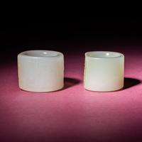 Two Chinese Jade Archer's Rings, 18th/19th Century — 清中期 白玉留皮扳指兩枚