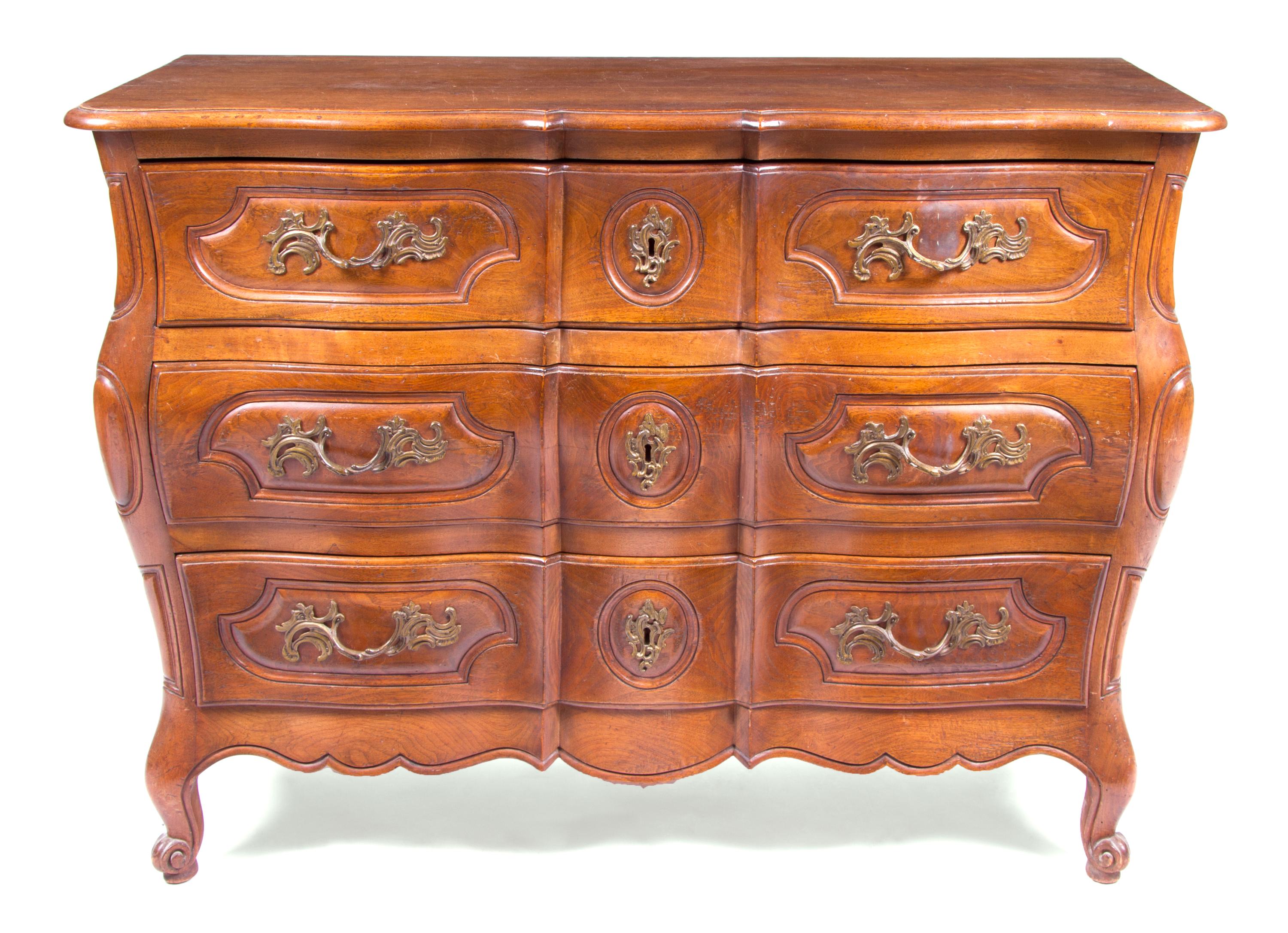 A Louis XV Provincial Style Commode Height 35 x width 50 x depth 21 1/4 inches. — 20TH CENTURY