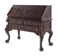 A Renaissance Revival Carved Mahogany Slant-Front Bureau