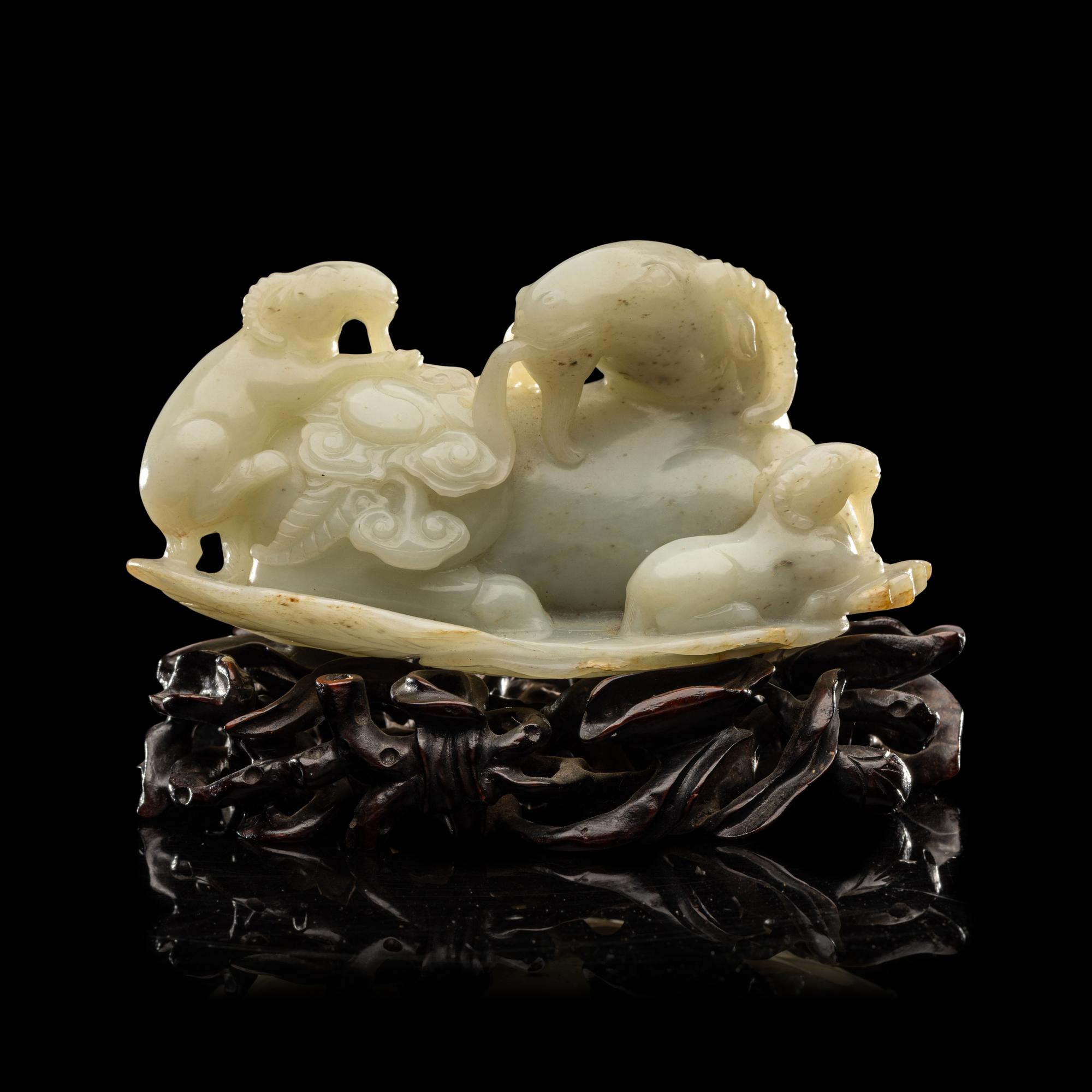 A Chinese Pale Celadon Jade 'Three Rams' Carving 青白玉三羊開泰