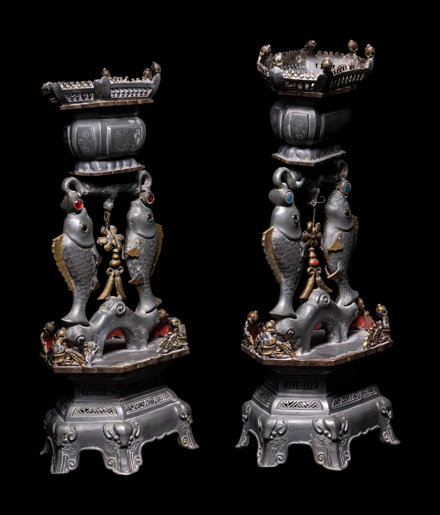 A Pair of Chinese Glass Inset Pewter 'Abundance' Candle Holders