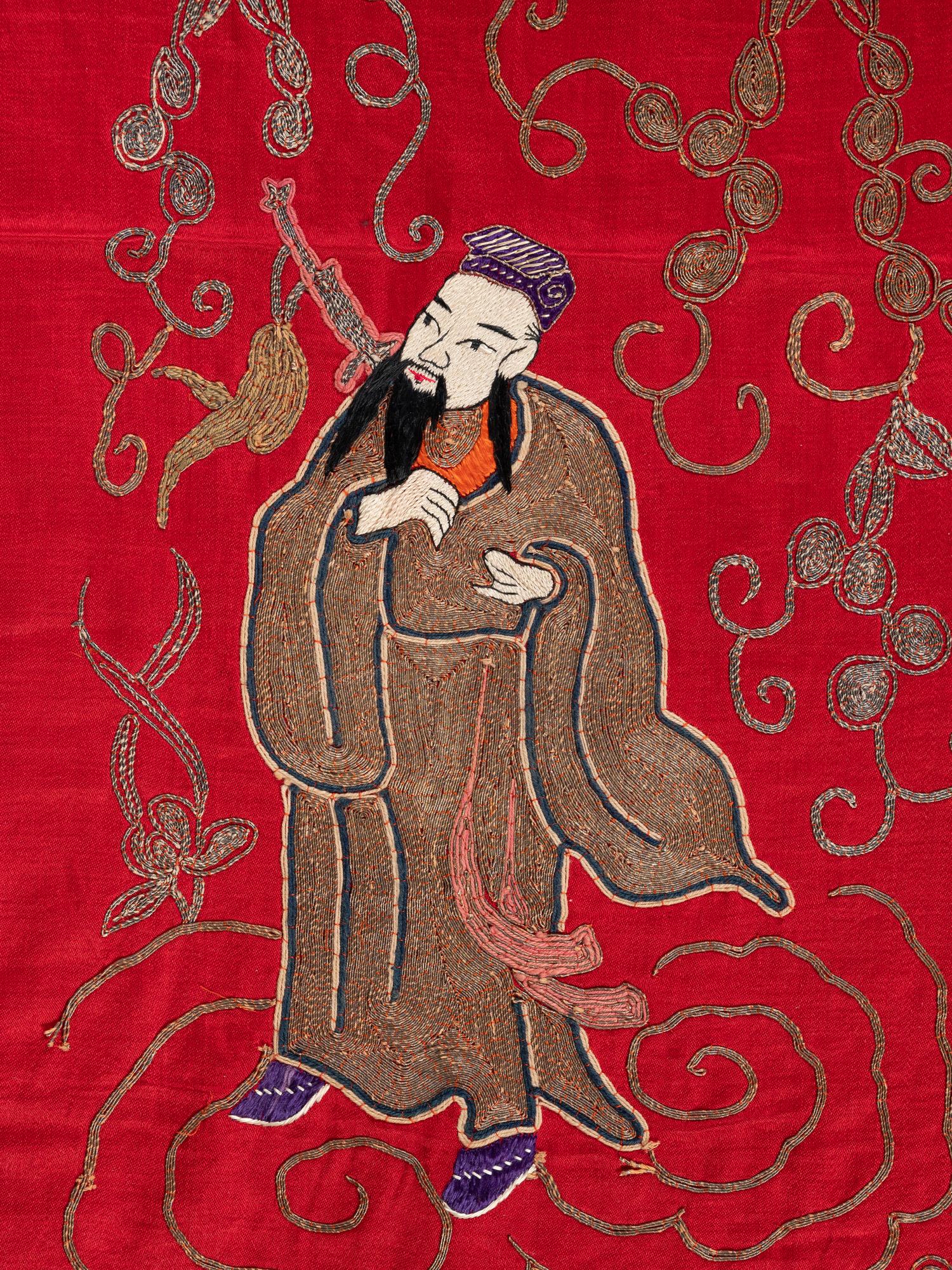 A Pair of Chinese Red Ground Embroidered Silk Panels