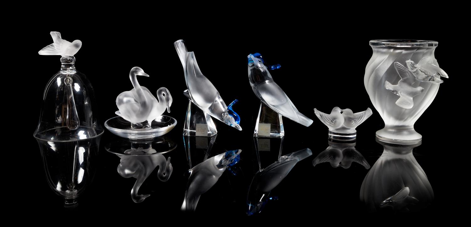 Lalique, a group of six molded and frosted glass bird motif table articles, comprising a vase, a bell, a ring tray and three figures