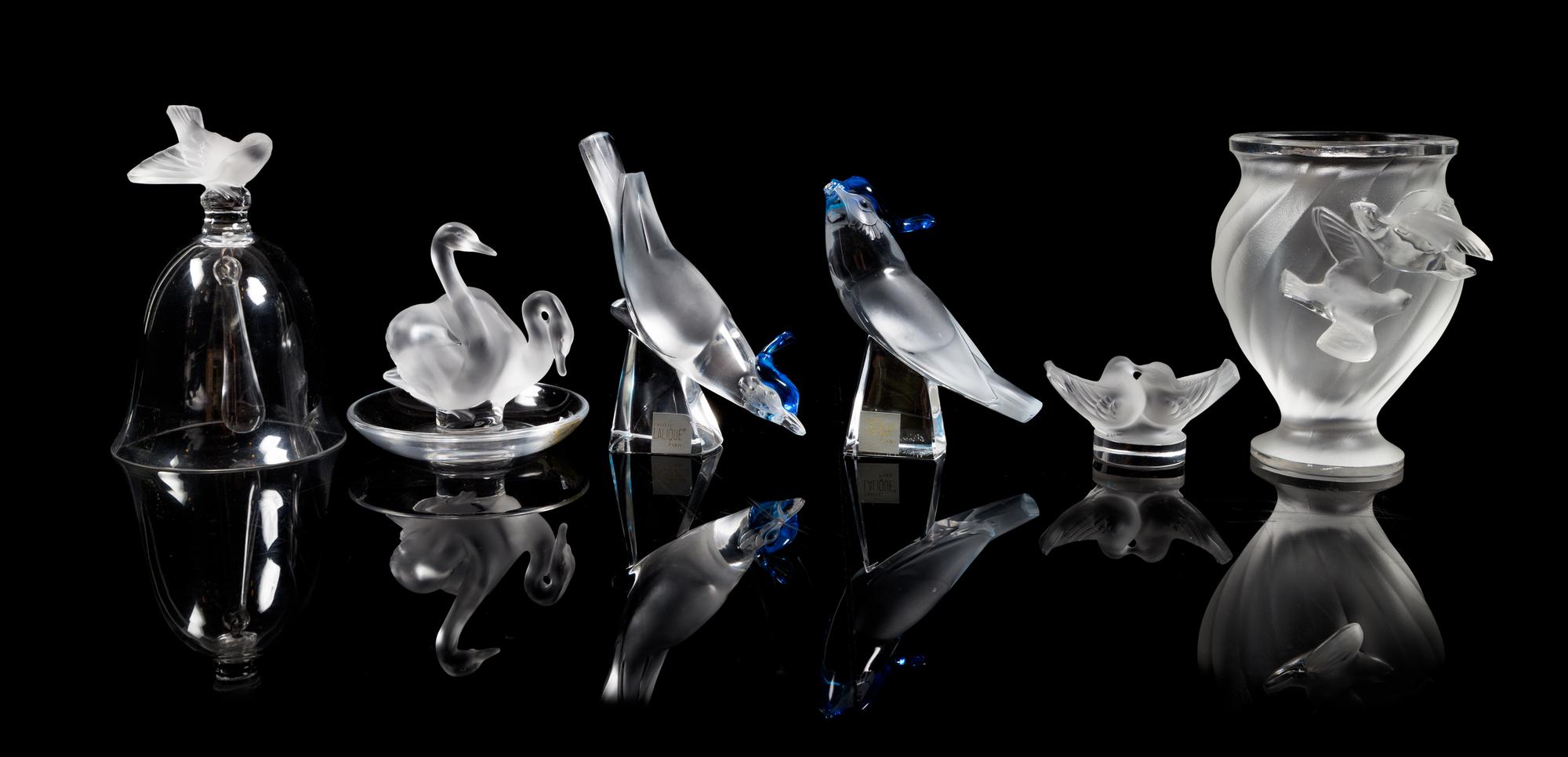 Lalique, a group of six molded and frosted glass bird motif table articles, comprising a vase, a bell, a ring tray and three figures