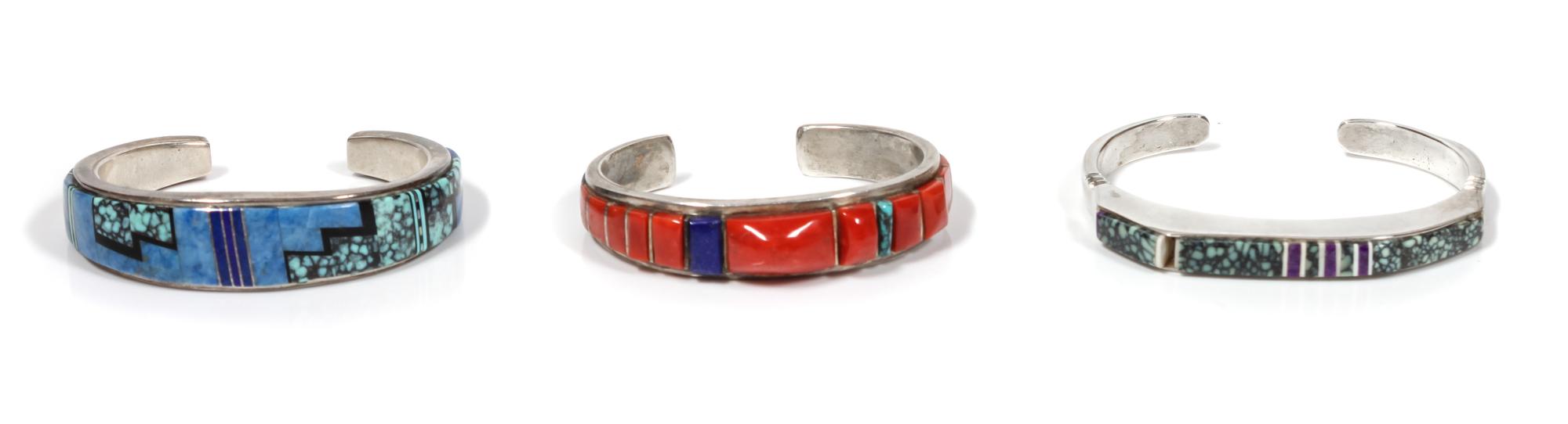 Three Southwestern Silver and Multi-Stone Bracelets Length of first 4 3/4 x opening 3/4 x width 1/2 inches