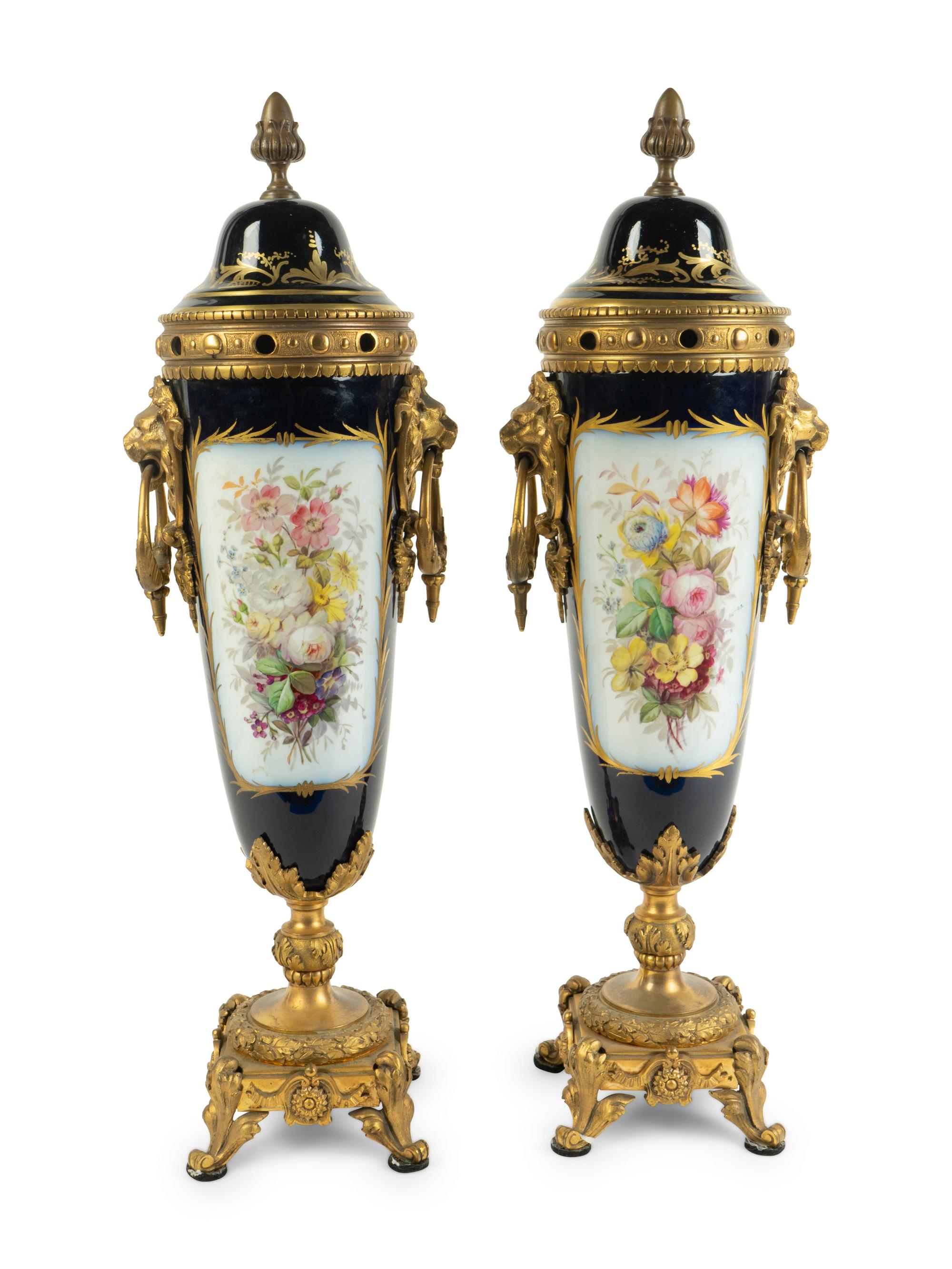 A Pair of Gilt Bronze Mounted Sèvres Style Porcelain Covered Urns — 19TH CENTURY