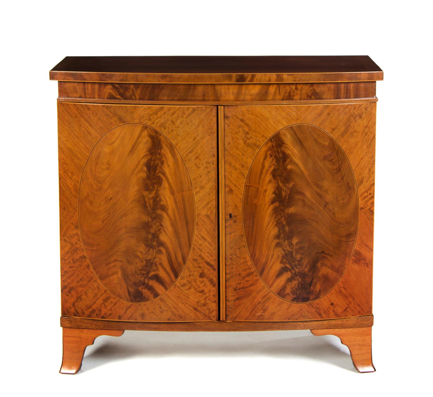 A Regency Style Bow Front Cabinet, Height 40 x width 42 x depth 20 1/4 inches.