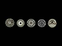 Five Chinese Pale Celadon Jade Carved and Reticulated Circular Pendants