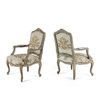 A Pair of Italian Rococo Style Painted and Parcel Gilt Armchairs