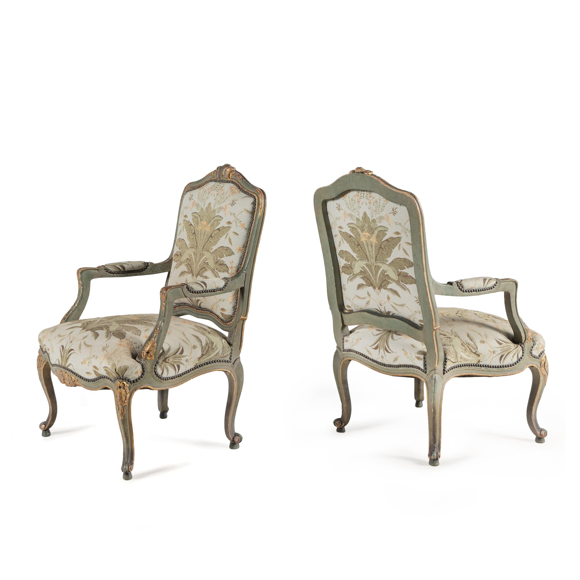 A Pair of Italian Rococo Style Painted and Parcel Gilt Armchairs