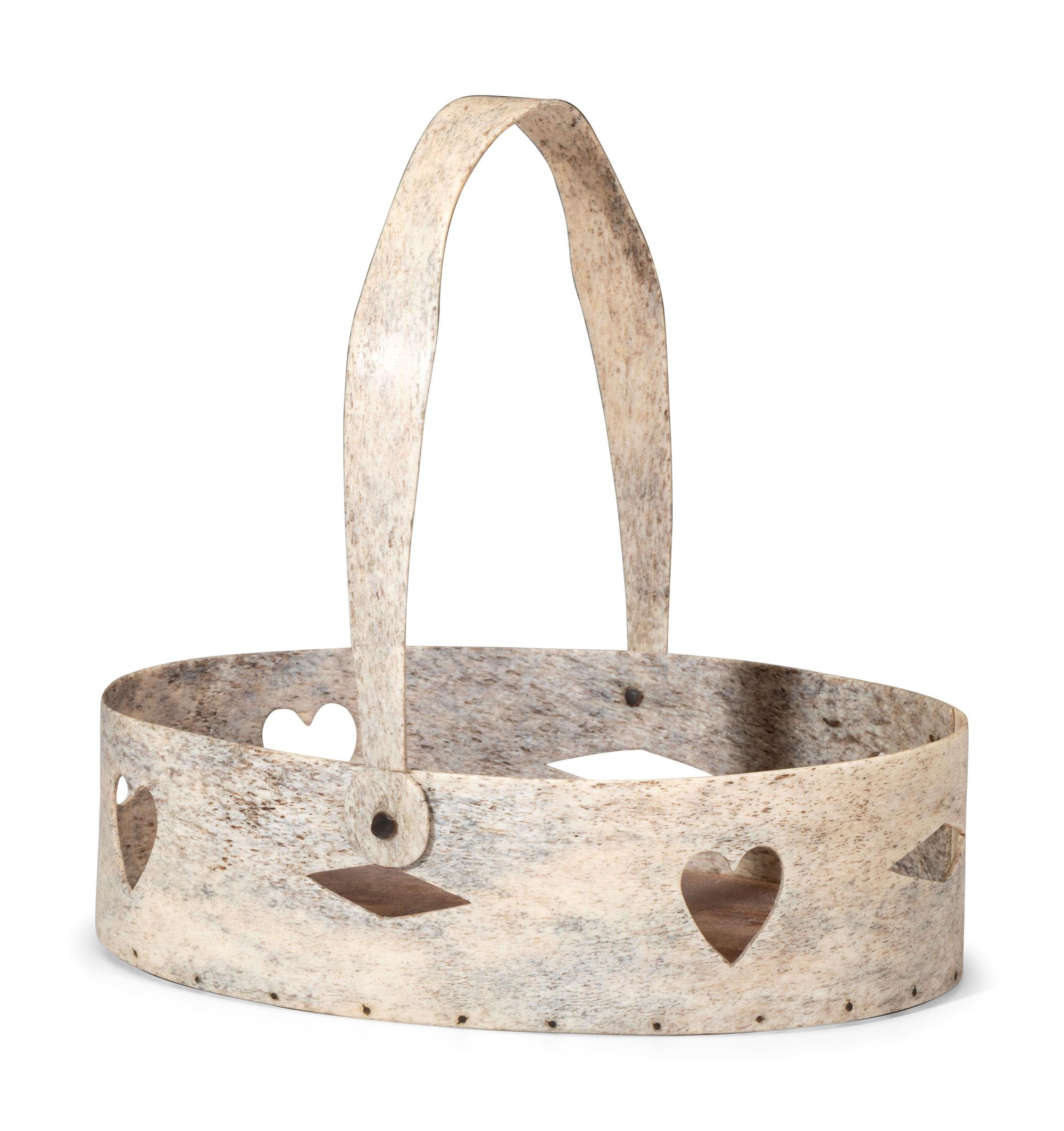 A Carved and Pierced Whale Bone Swing-Handle Basket