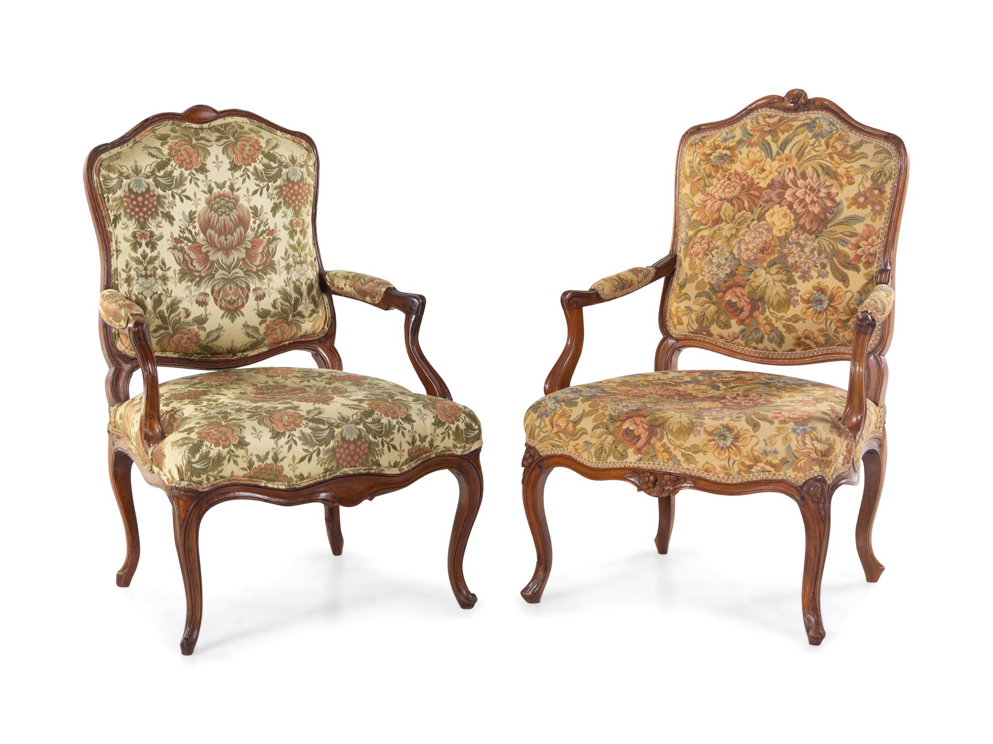 A Pair of Louis XV Style Carved Walnut Fauteuils