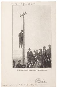 [COLORADO]. Photo-reproduction postcard, "I'm Hanging Around Canon City." Canon City, CO: H. N. Beecher, ca 1900.