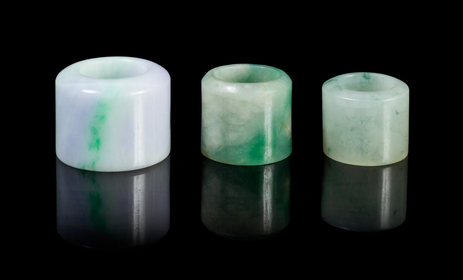 Three Jadeite Archer's Rings Diameter of largest 1 1/2 inches.