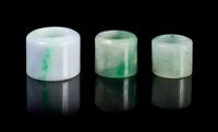 Three Jadeite Archer's Rings Diameter of largest 1 1/2 inches.