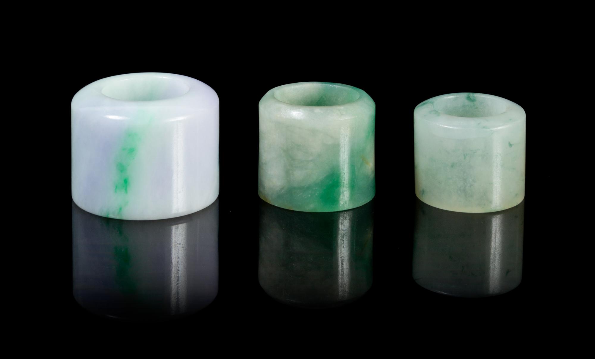 Three Jadeite Archer's Rings Diameter of largest 1 1/2 inches.