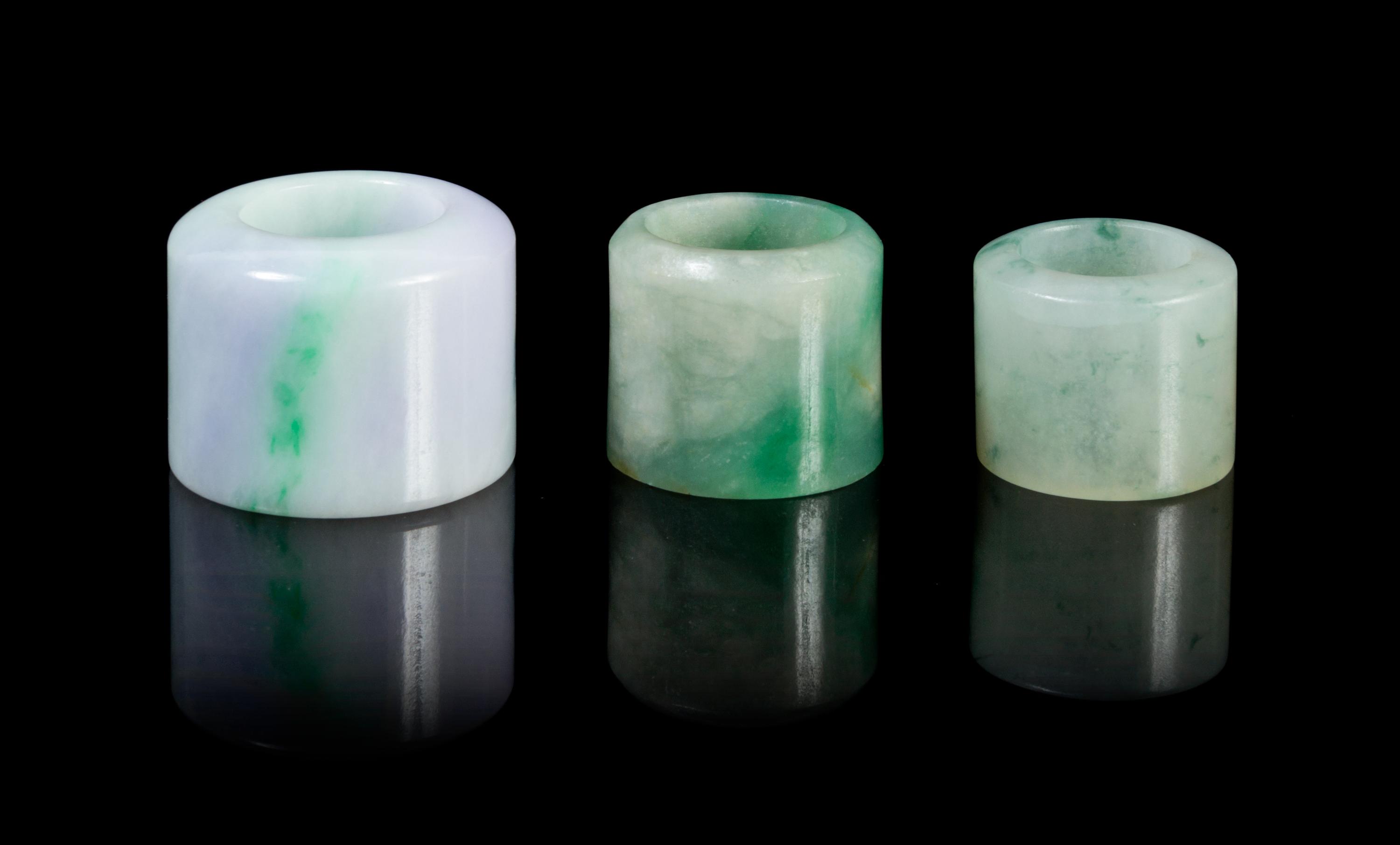 Three Jadeite Archer's Rings Diameter of largest 1 1/2 inches.