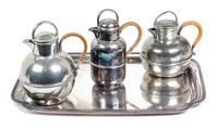 Three Wicker Handled Teapots and a Silverplate Tray Length of tray 14 1/4 inches. — 20TH CENTURY