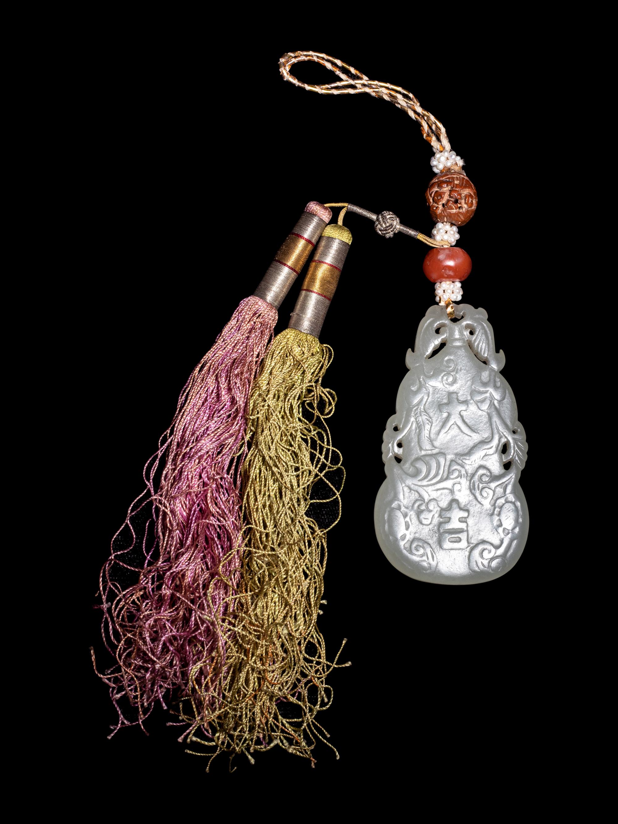 A Celadon Jade Gourd-Form Pendant