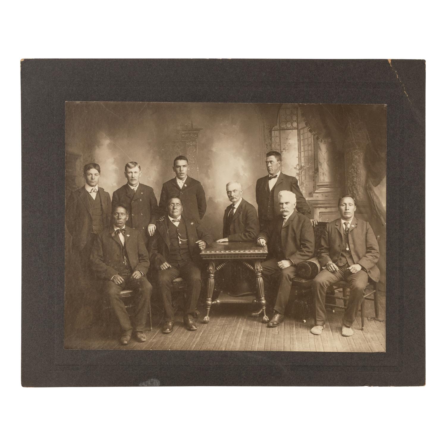 Studio portrait of Major James McLaughlin and Native American Subjects