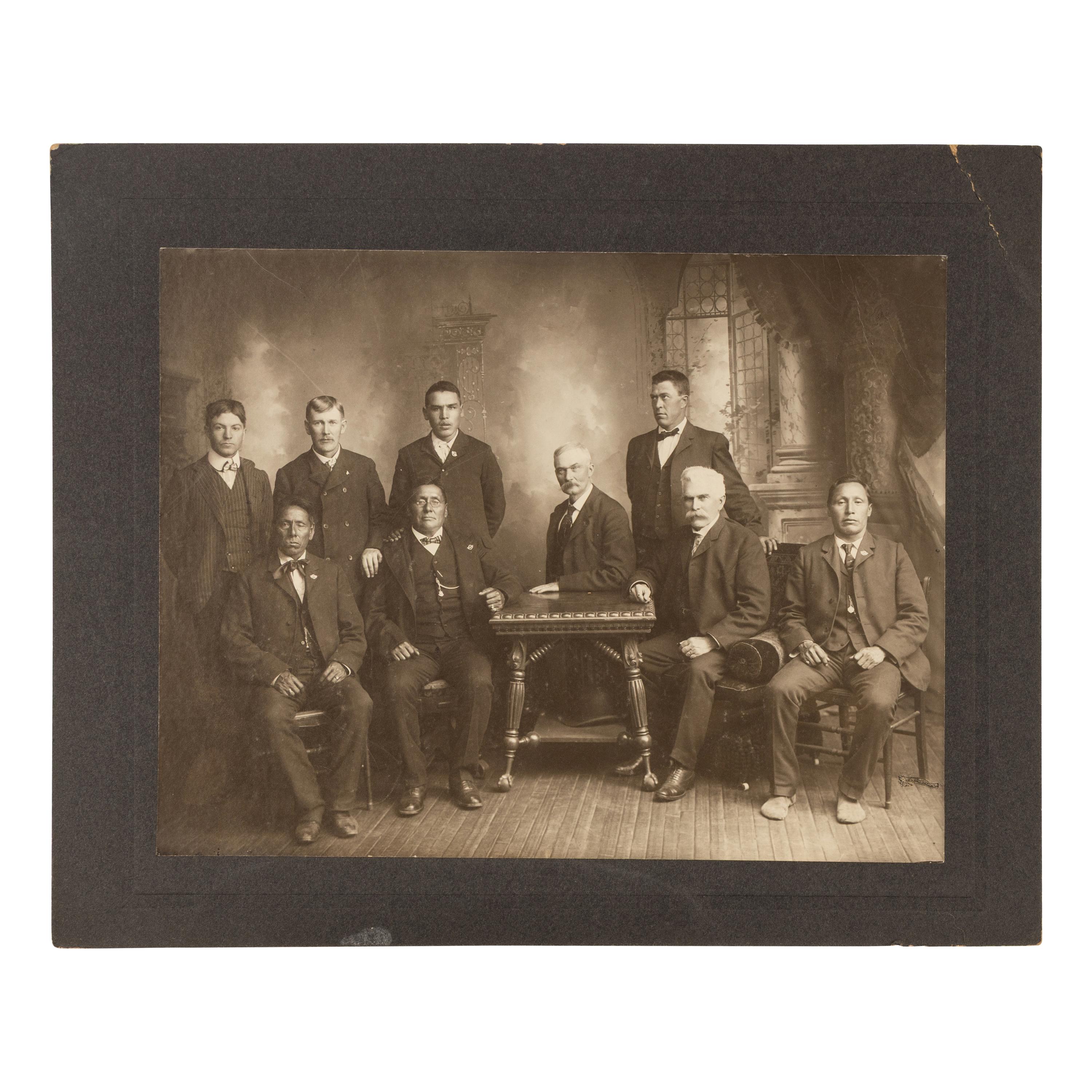 Studio portrait of Major James McLaughlin and Native American Subjects