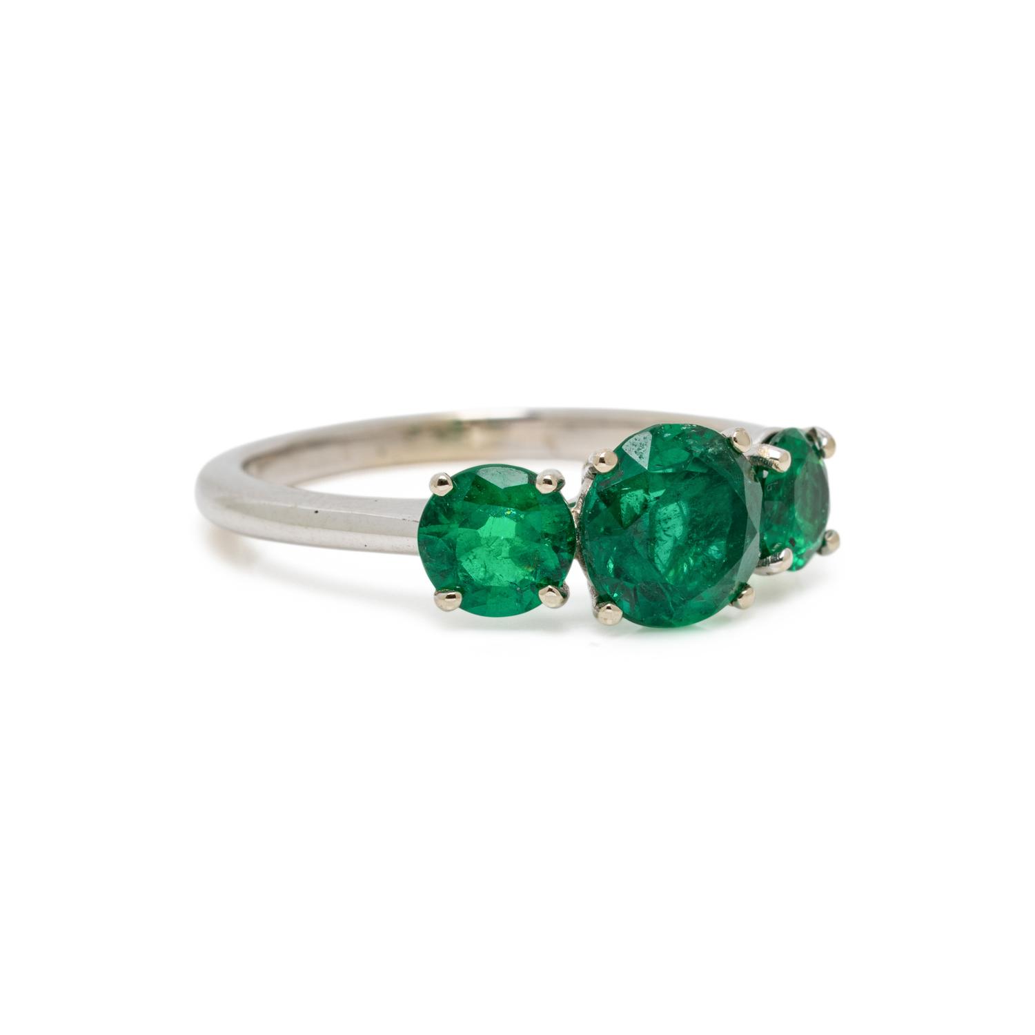 THREE STONE EMERALD AND WHITE GOLD RING