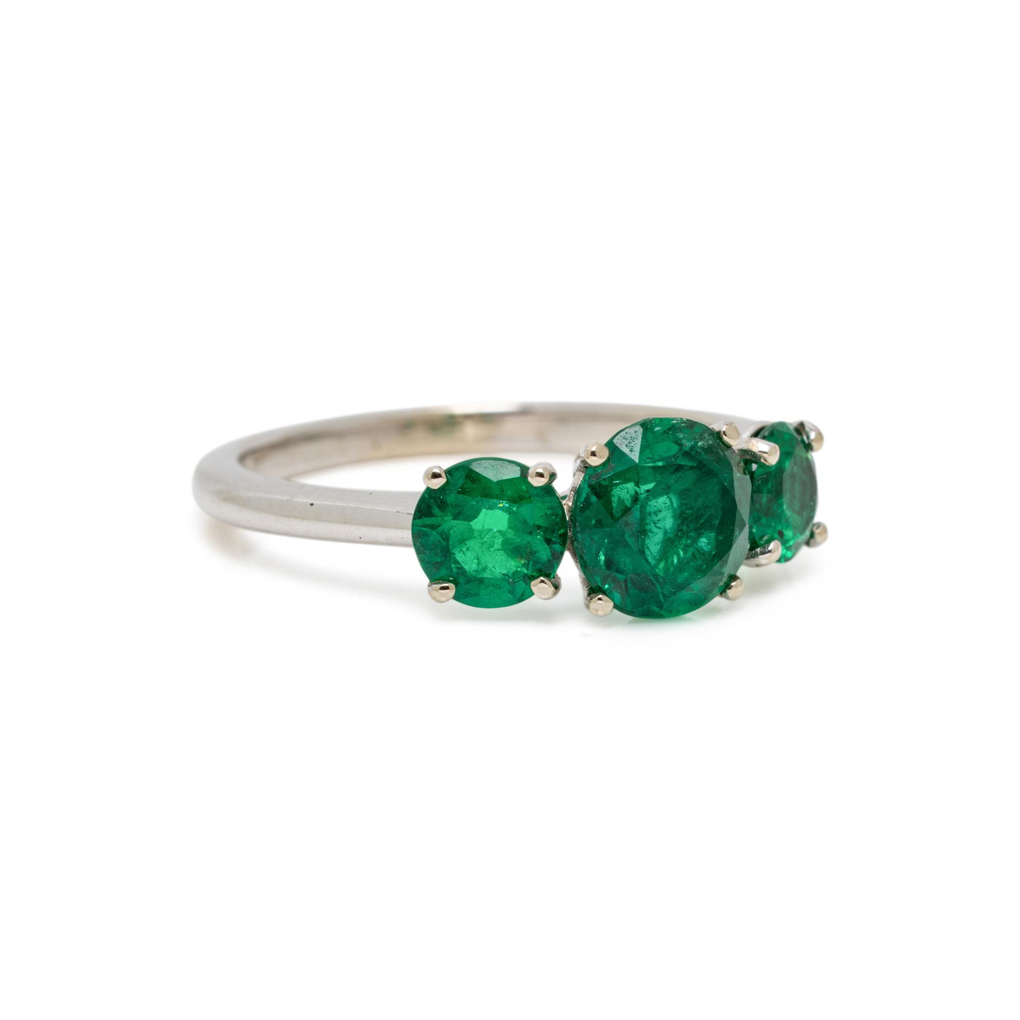 THREE STONE EMERALD AND WHITE GOLD RING