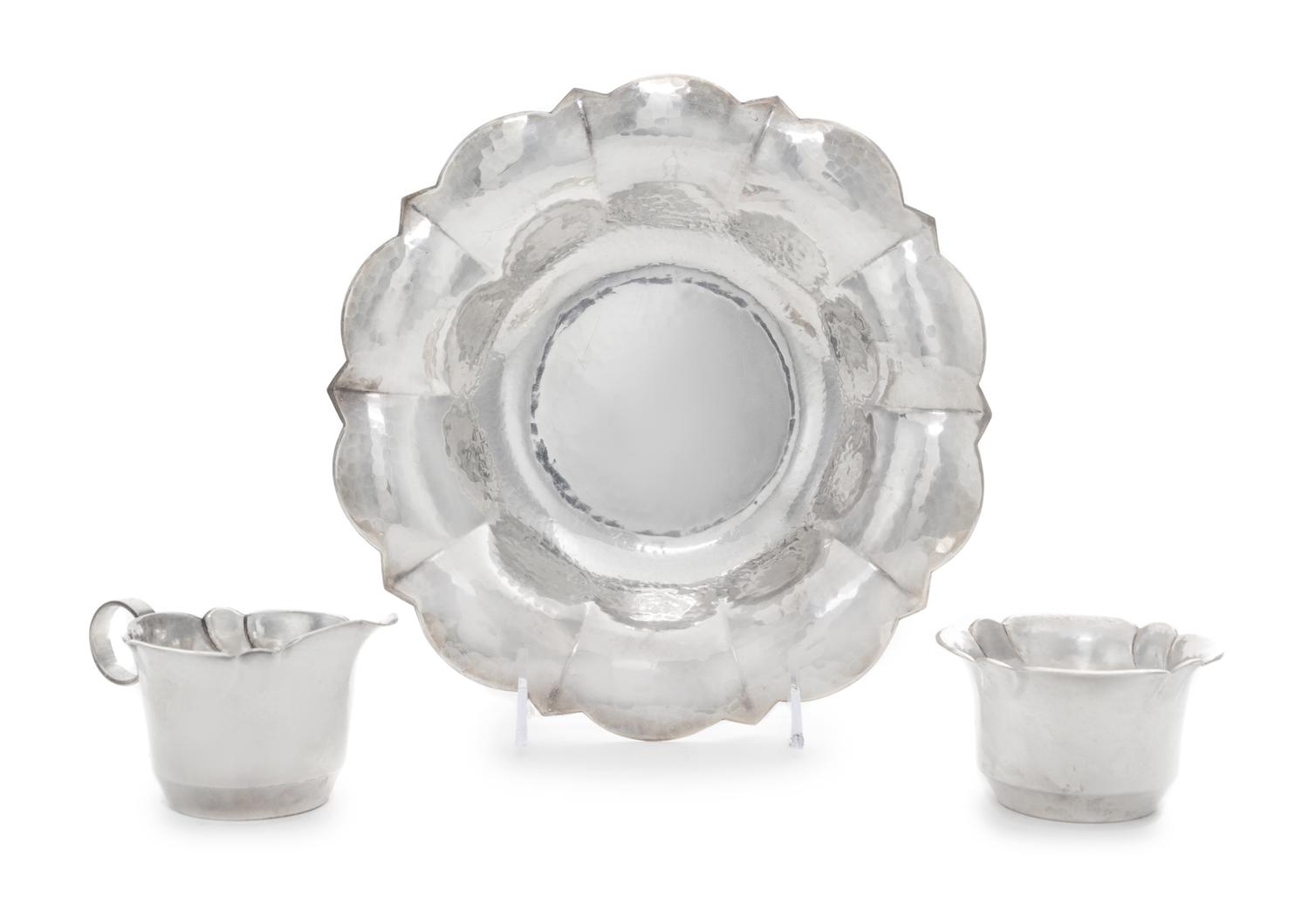 A German Silver-Plate Dish and Matching Creamer and Sugar Bowl, Maker's Mark Two Horse Heads, 20th Century, each having a spot-hammered