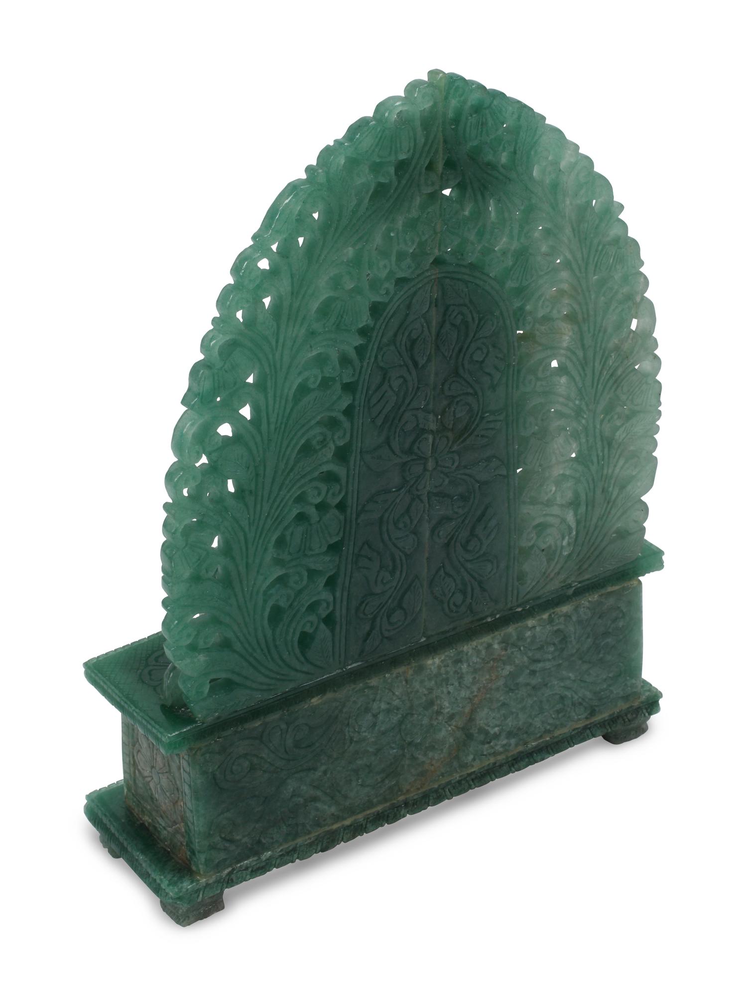 A Carved Green Jasper Figure of a Deity