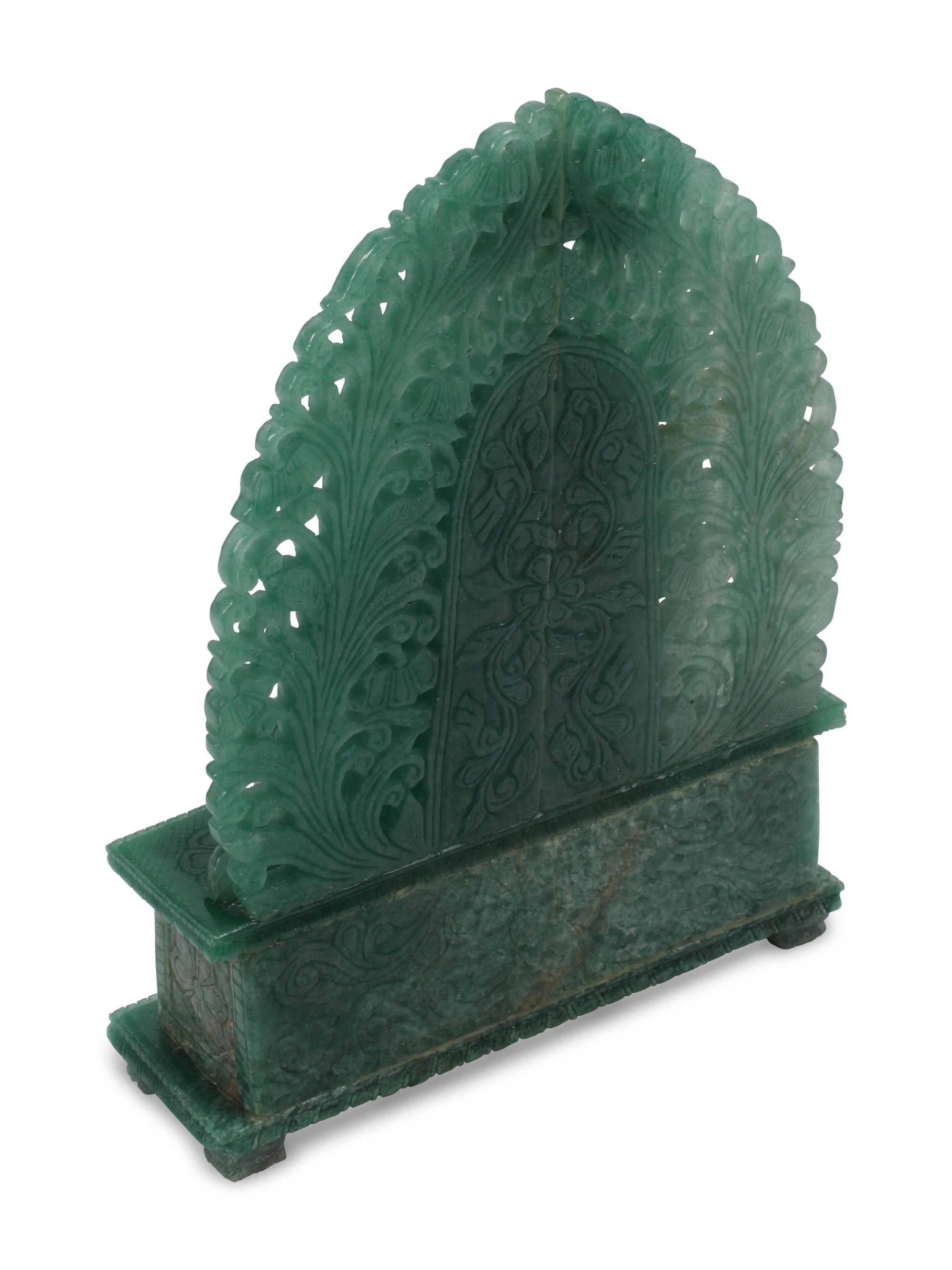 A Carved Green Jasper Figure of a Deity