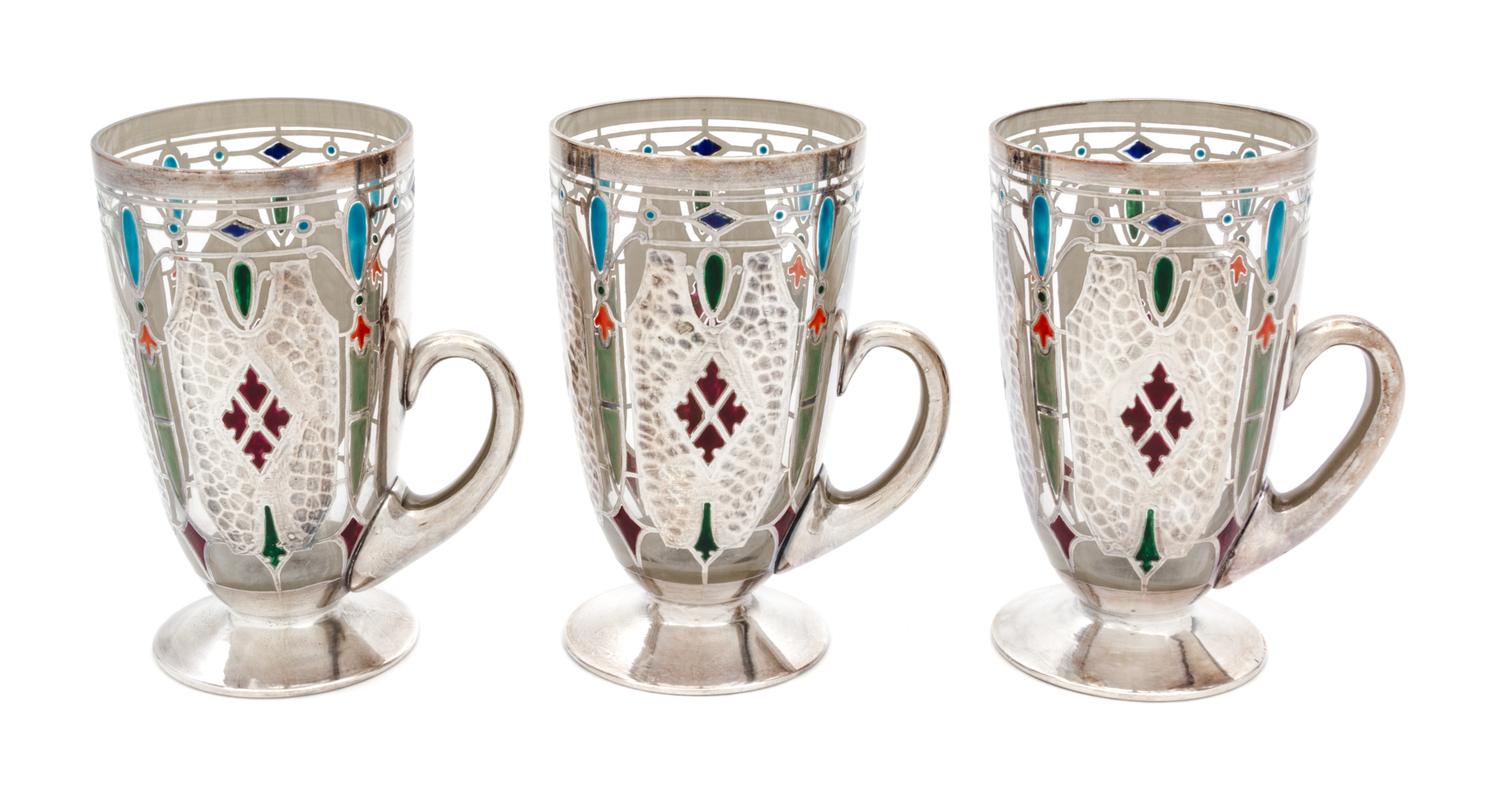 Three Art Nouveau Enameled and Silver Overlay Glass Mugs Height 5 1/4 inches.