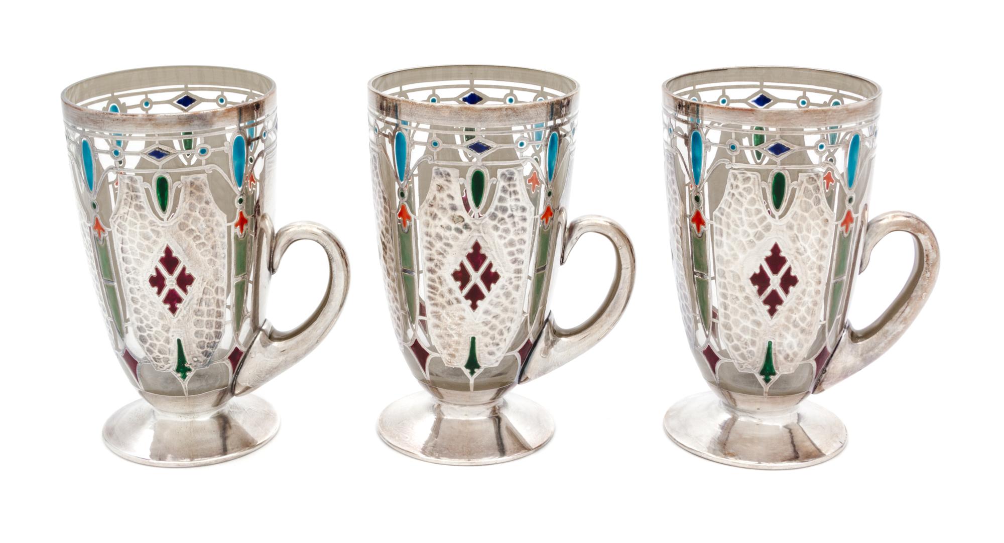 Three Art Nouveau Enameled and Silver Overlay Glass Mugs Height 5 1/4 inches.